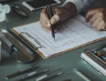 A photo of a doctor doing paperwork.